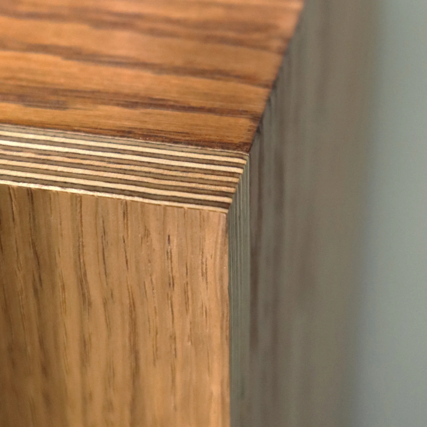 Close detail of real wood veneer and exposed layered plywood edge