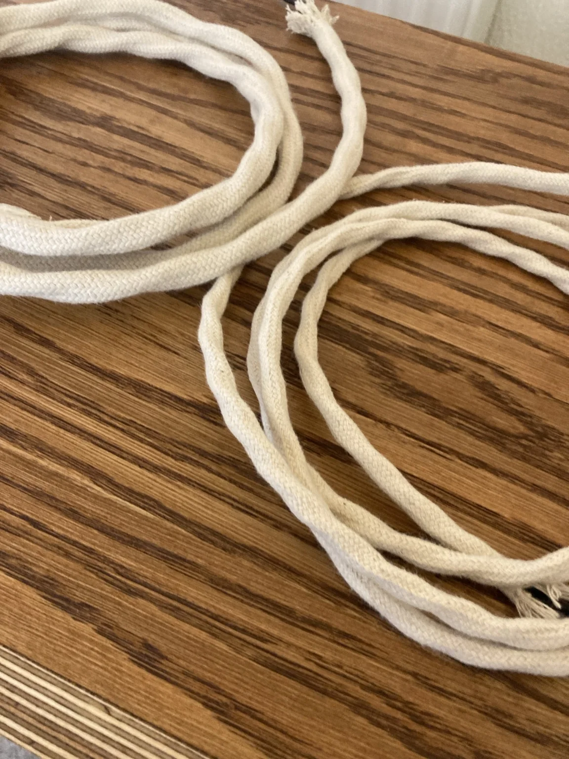 Hand-twisted loudspeaker cable wrapped in white cotton