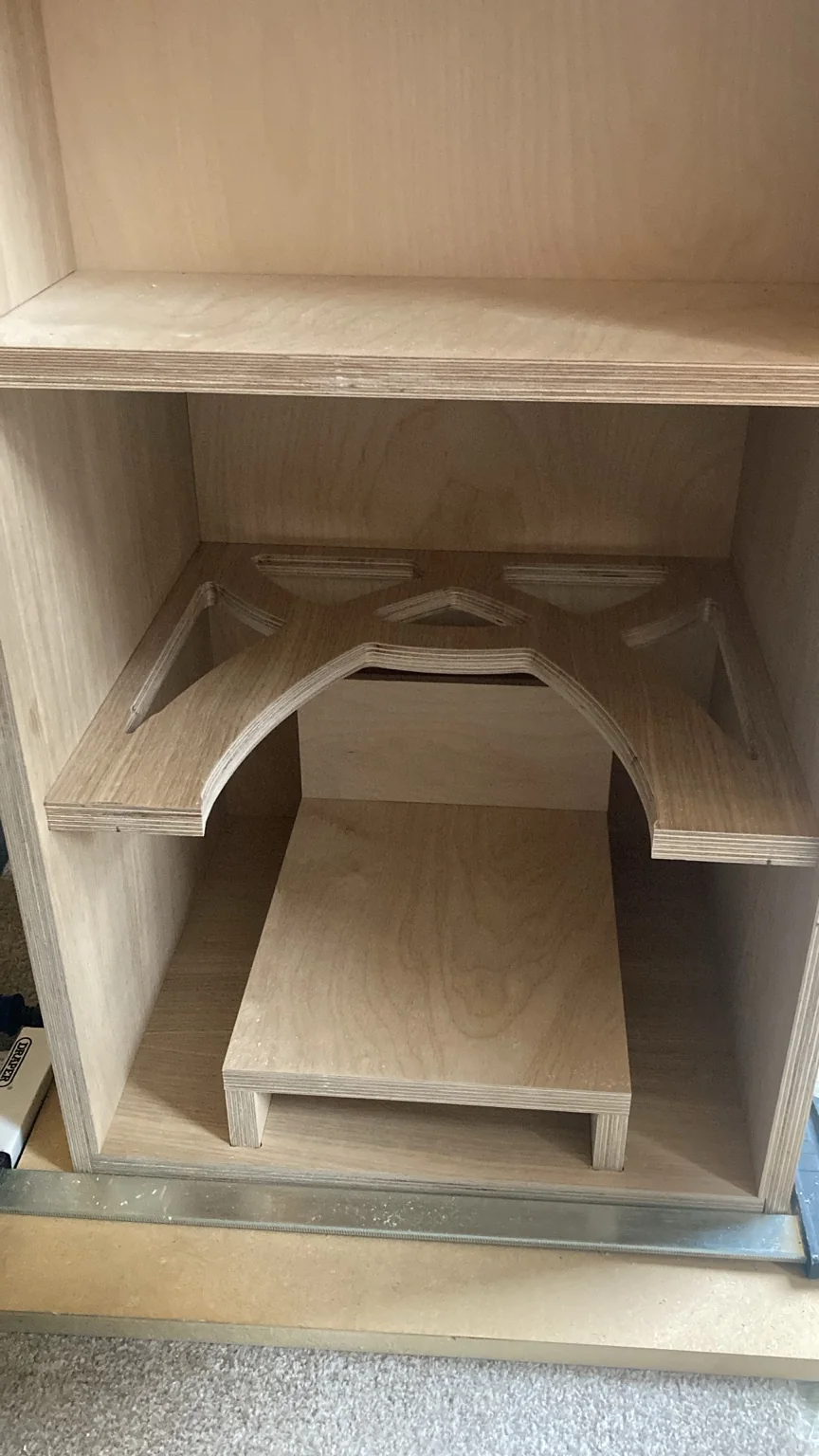 Unfinished Cwen cabinet showing its internal arched brace and port structure